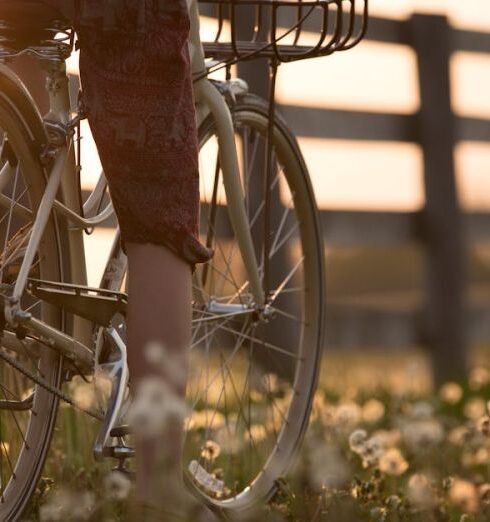 Biking - Person Riding Bicycle Near Fence