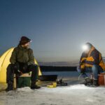 Fishing - Men Fishing in a Frozen Lake