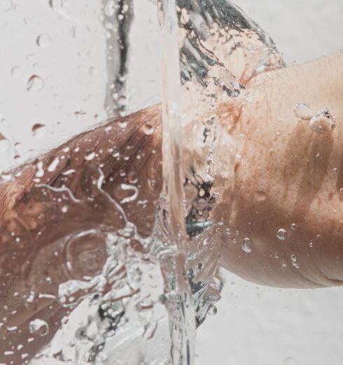 Hygiene - Person's Left Fist Punching Water