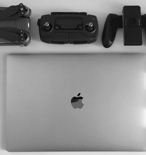 Gadgets - Silver Macbook Surrounding Black Electronic Devices