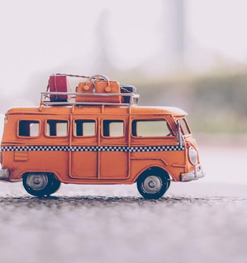 Suitcase - Orange Van Die-cast Model on Pavement