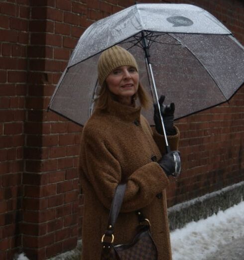 Waterproof Bags - Photo of a Woman Carrying Umbrella