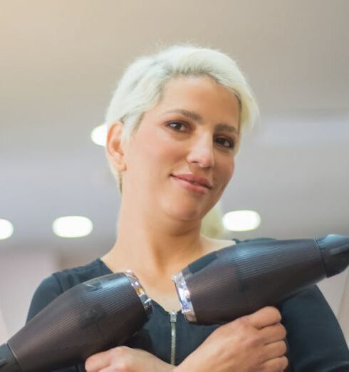 Hairdryers - Woman Wearing Black Long Sleeve Shirt Holding Hairdryers