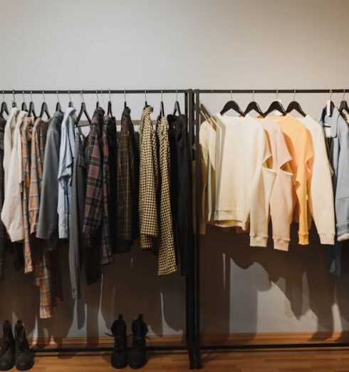 Laundry Solutions - White and Black Clothes Hanging on Black Steel Rack