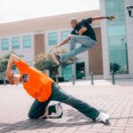 Beginners - Two Men Dancing on Concrete Pavement