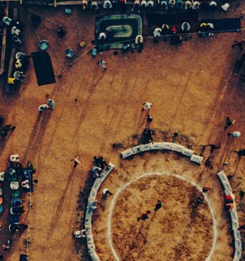 Local Groups - Top View of Rural Stadium with People Gathered around Stage