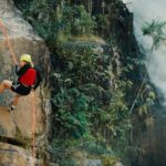 Rock Climbing - Woman Rocking Climbing Near Waterfalls