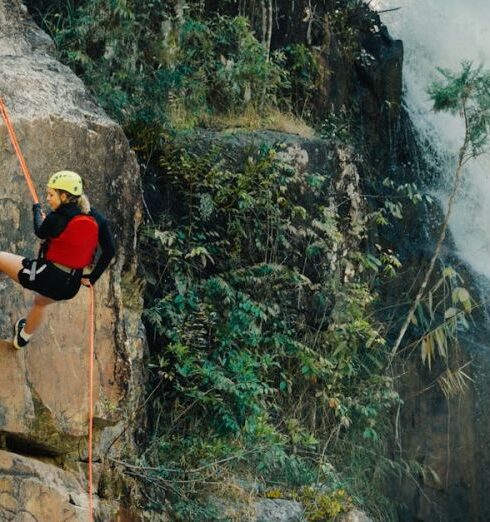 Rock Climbing - Woman Rocking Climbing Near Waterfalls