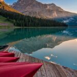 Landscapes - Red Canoes on Sea Dock Near Calm Body of Water