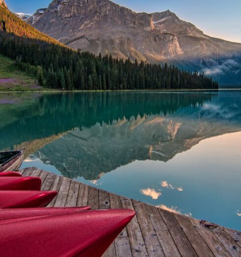 Landscapes - Red Canoes on Sea Dock Near Calm Body of Water