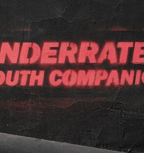 Underrated - Spray Painted Slogan on a Black Wall