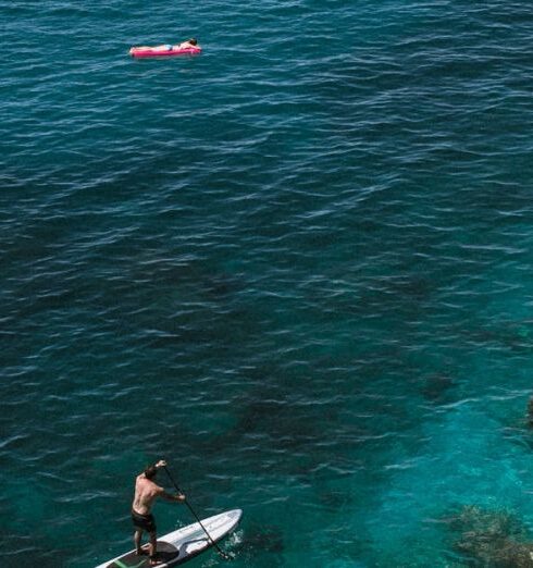 Destinations - Boats floating on calm sea