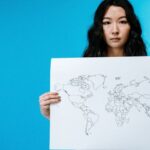 Countries - Woman Holding World Map