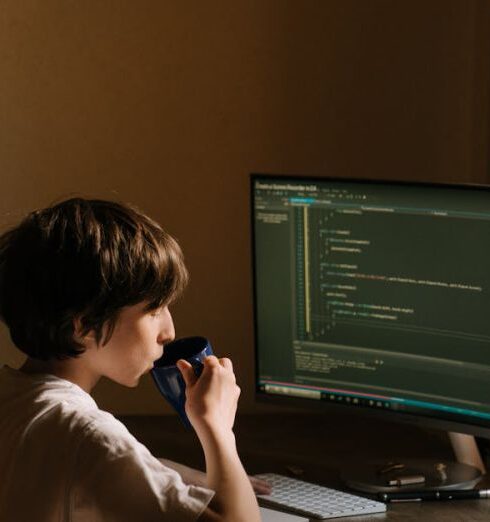 Hacks - Boy in White T-shirt Sitting on Chair in Front of Computer