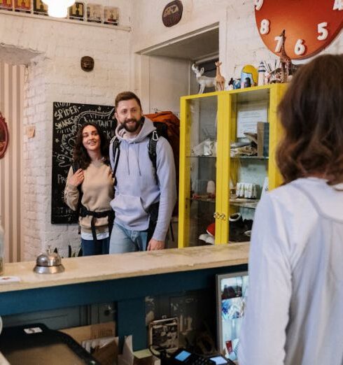 Hostels - Backpackers Approaching Front Desk