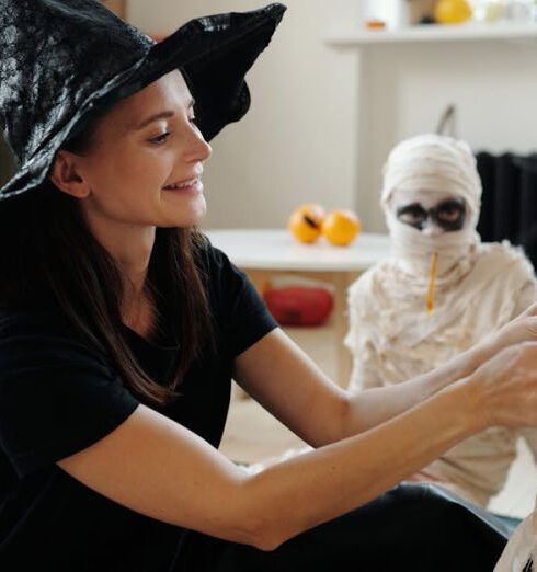 Activities - Mother Dressing Up Her Kids With Mummy Costume