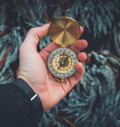 Explore - Person Holding Compass