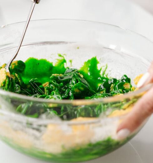 Meal Prep - Person Mixing a Vegetable Salad in a Bowl