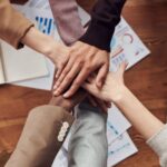 Groups - Photo Of People Near Wooden Table