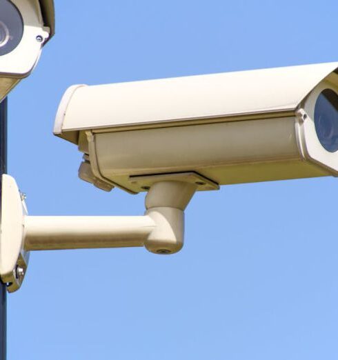 Safety - White 2 Cctv Camera Mounted on Black Post Under Clear Blue Sky