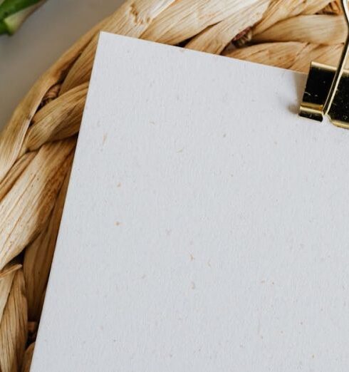 Diet - Paper sheet fastened by paper clip on wicker table mat