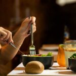 Diet - person holding silver fork and knife