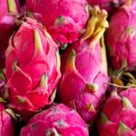 Diet - a pile of pink dragon fruit sitting on top of a table