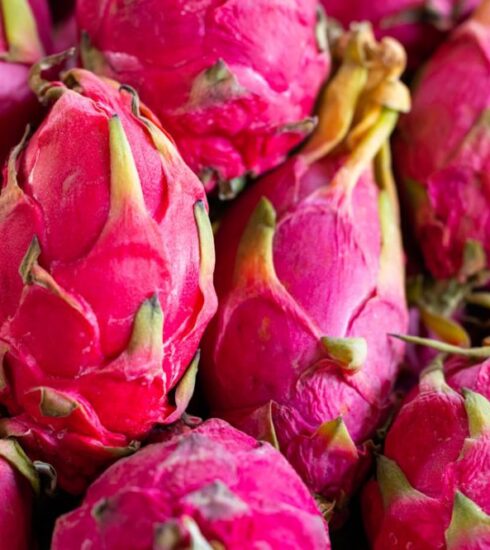 Diet - a pile of pink dragon fruit sitting on top of a table