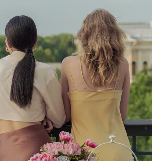 Foods - A Back View of Women Standing at the Balcony