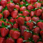 Diet - a large group of strawberries with leaves on them