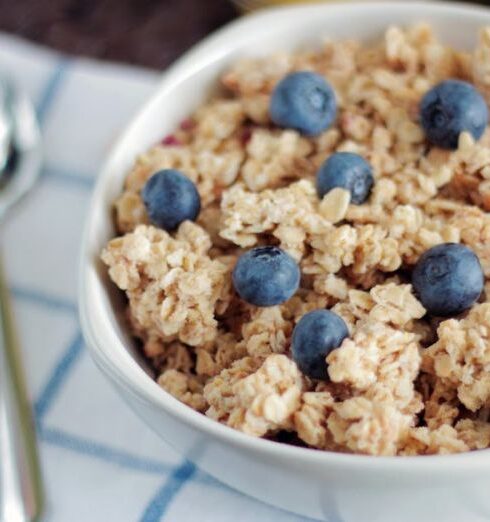 Muesli - Bowl of Cooked Foods Beside Spoon