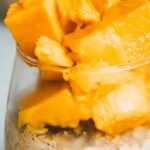 Muesli - Sliced Fresh Mango in a Glass of Creamy Yoghurt