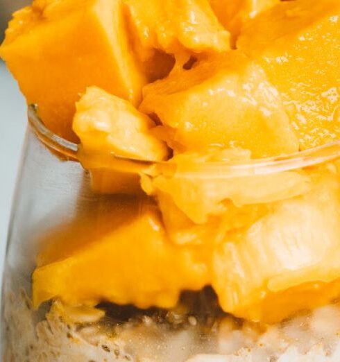 Muesli - Sliced Fresh Mango in a Glass of Creamy Yoghurt