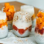 Muesli - Chia Seeds and Yoghurt Cream on Clear Glasses