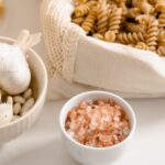 Muesli - Variety of Pasta with Bowls of Garlic and Salt on Table