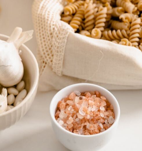 Muesli - Variety of Pasta with Bowls of Garlic and Salt on Table