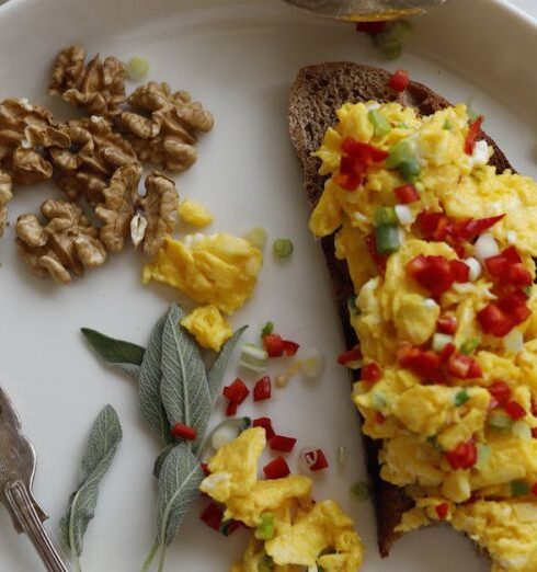 Healthy Eating - A plate with scrambled eggs, tomatoes, and other ingredients