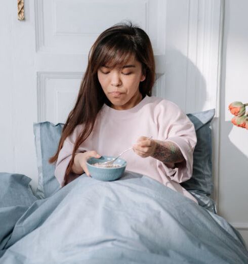 Muesli - Woman eating breakfast in a bed