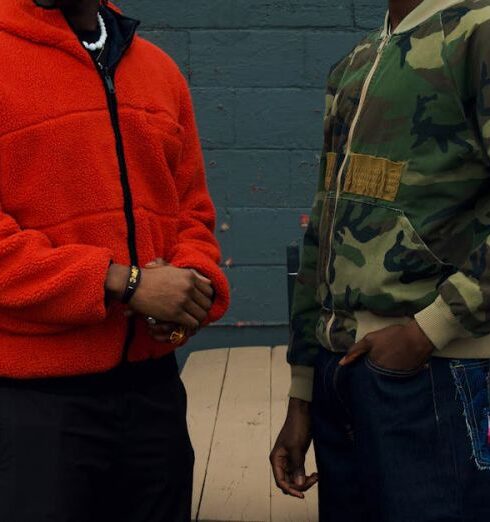 Bomber Jackets - Two Young Men in Streetwear Outfits Standing near a Building