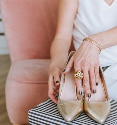 Accessorize - Woman in White Sleeveless Dress Wearing Gold Leather Peep Toe Heeled Shoes