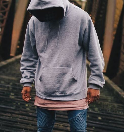 Hoodies - Man in Gray Pull-over Hoodie Standing on Train Rail