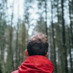 Jacket - Shallow Focus Photo of Man Wearing Black and Red Jacket Standing in Forest