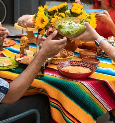 Foods - A Group of People Sitting on the Chair while Having Dinner