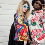 Hoodies - Two Women Standing Near Roller Shutter