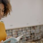 Turtleneck - Woman in Yellow Turtleneck Sweater Holding White Tablet Computer