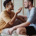 Eating - Man Feeding Pizza to Another Man