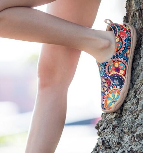 Espadrilles - A girl in shorts and sandals leaning against a tree