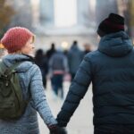 Jackets - Man and Woman Holding Hands While Walking at Park