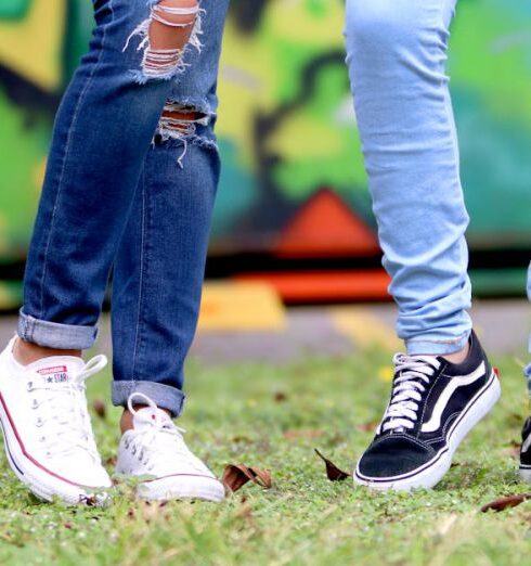 Jeans - Person's Wearing White and Black Low-top Sneakers