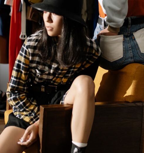 Skirts - Woman in Black and White Long Sleeve Shirt Sitting on Brown Wooden Chair